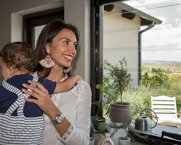 Woman sleeping peacefully in a secure Stellenbosch home protected by SheerGuard clear burglar bars